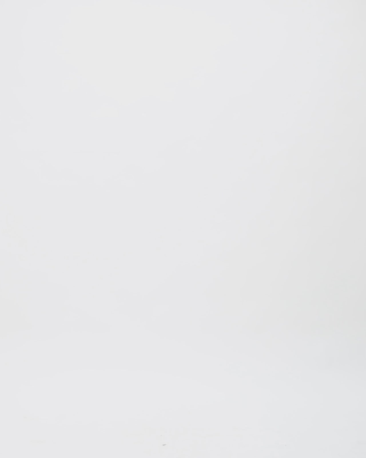 An asymmetrical neckline draped black dress with a structured see-through corset.