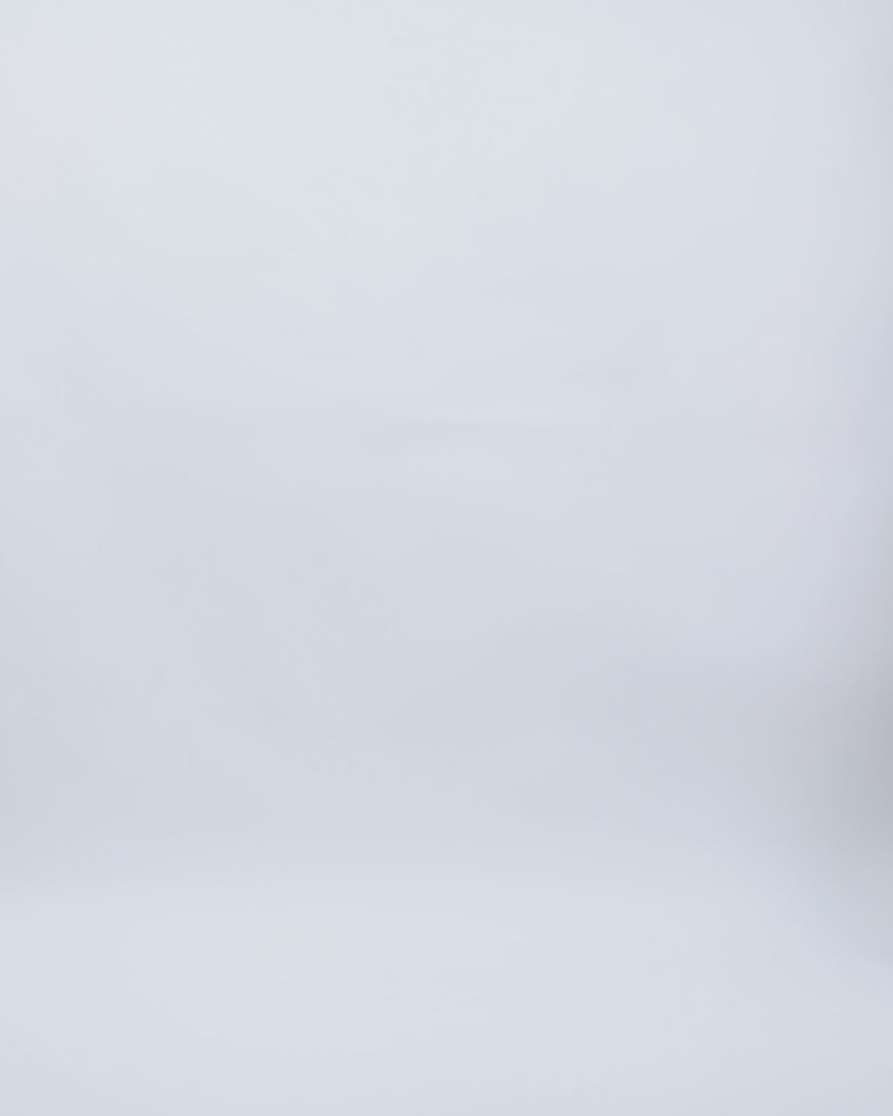 A long sleeved slim-cut evening dress in pink color featuring structured shoulders, draping and floral beadings on the waist.