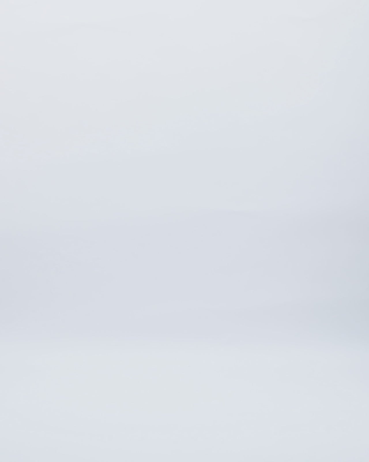 A draped asymmetrical neckline evening dress in dusty pink satin with a stone embellished collar.