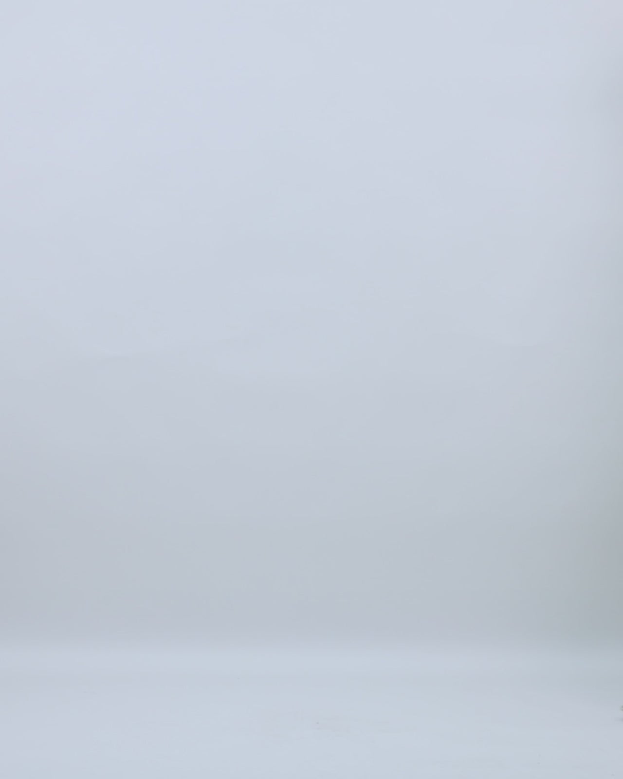 A three-quarter sleeves evening dress in pale sage with beadings on the shoulders and a cape-like back.