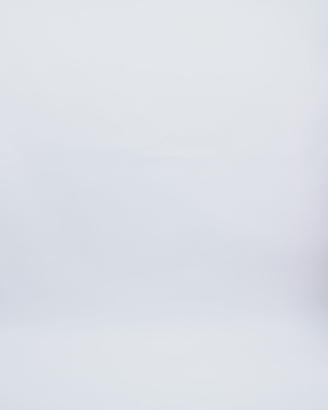 A fully beaded fringes evening dress featuring a one-shoulder crepe fold-over, and a single floor-length sleeve.