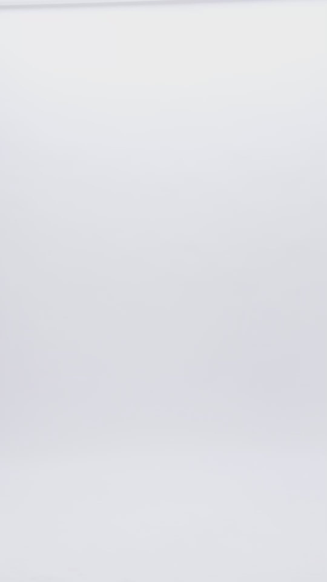 An evening wear pink set featuring a puffed-shoulders, draped cropped top paired with wide high-waist pants.