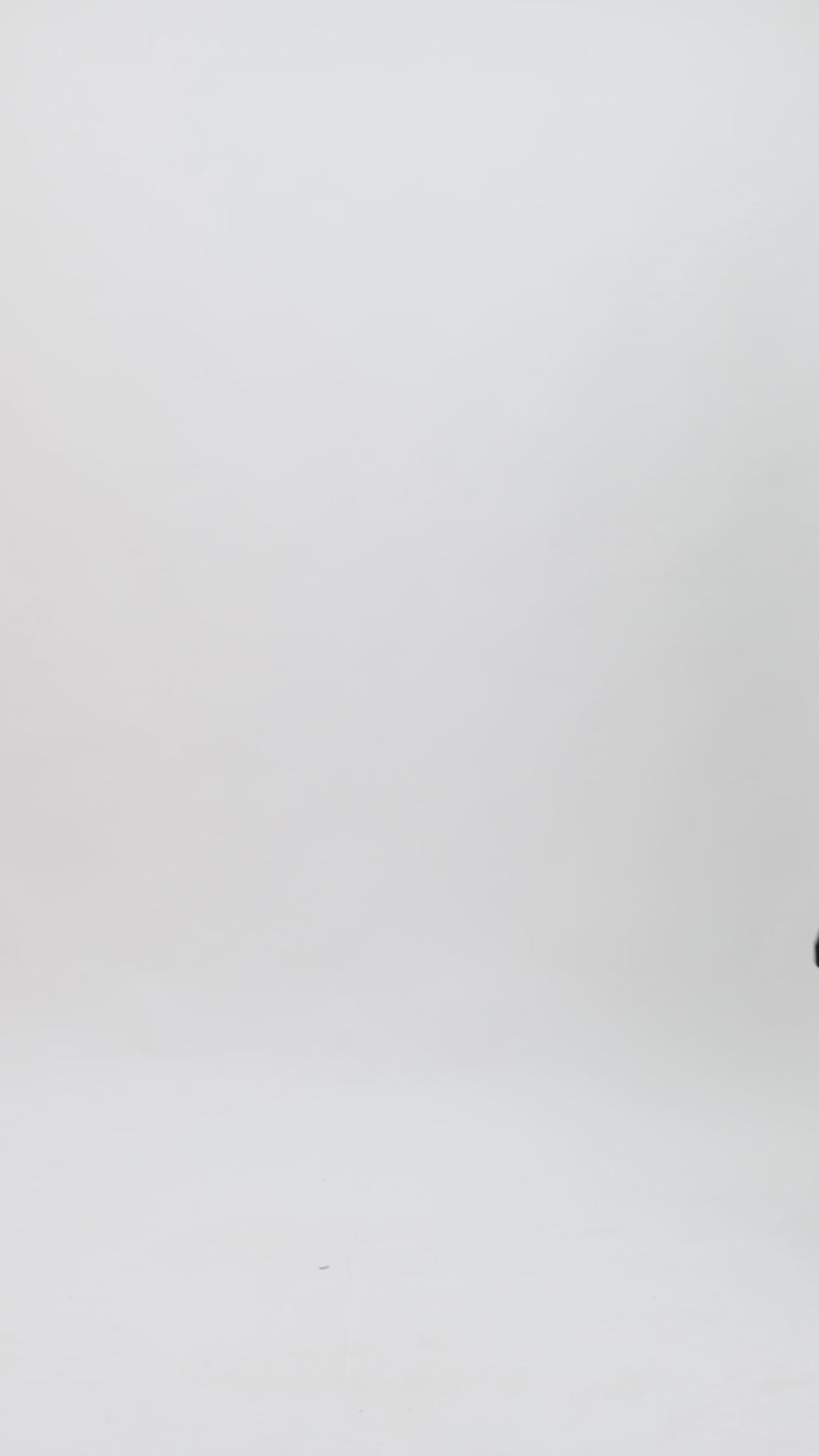 An evening wear set featuring an off-the-shoulders draped floral see-through corset paired with a midi skirt with draped florals on the hemline.