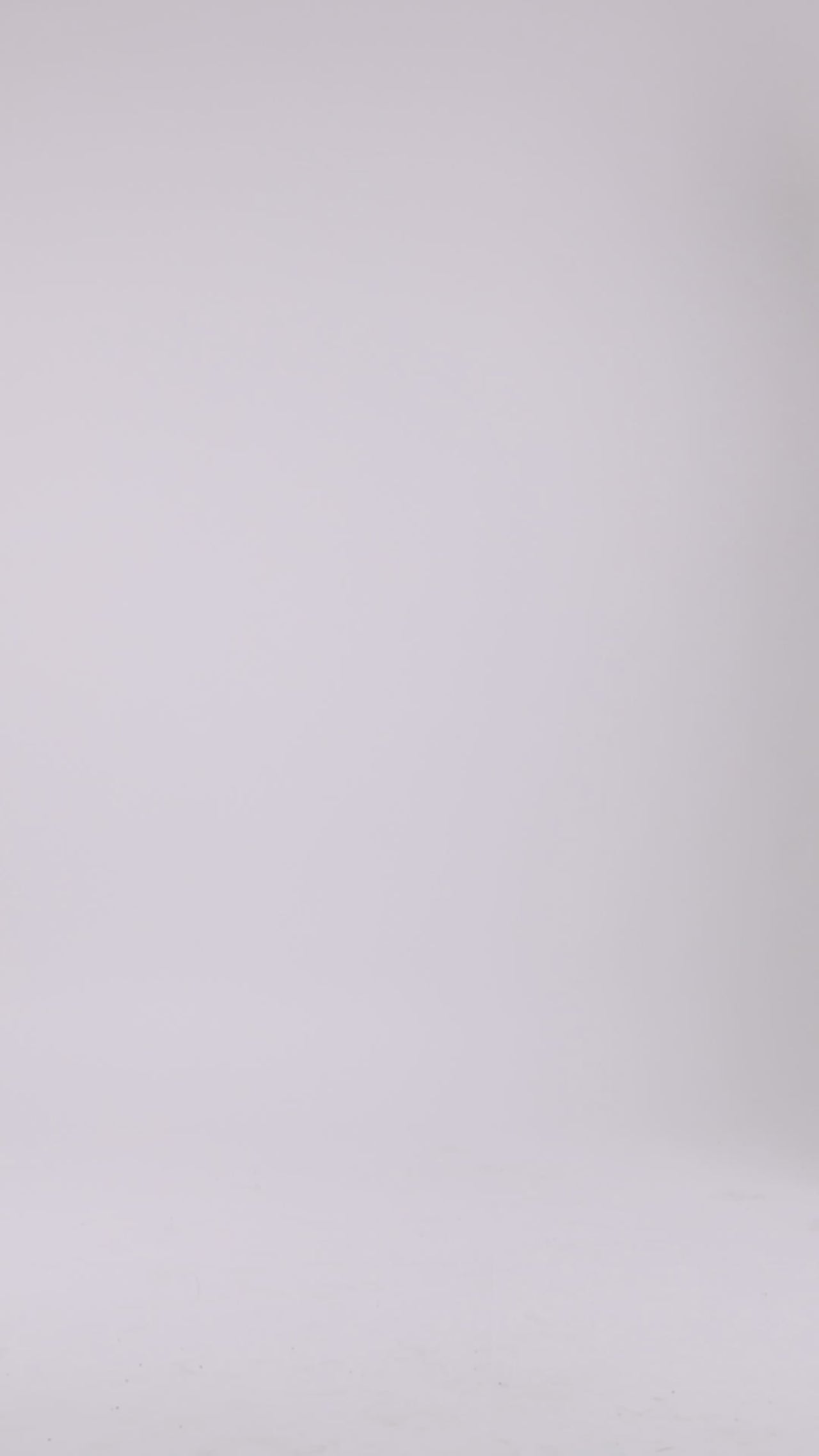 A one shoulder dress with draping details, open ruffled slit on the side, and a puffed see-through sleeve.