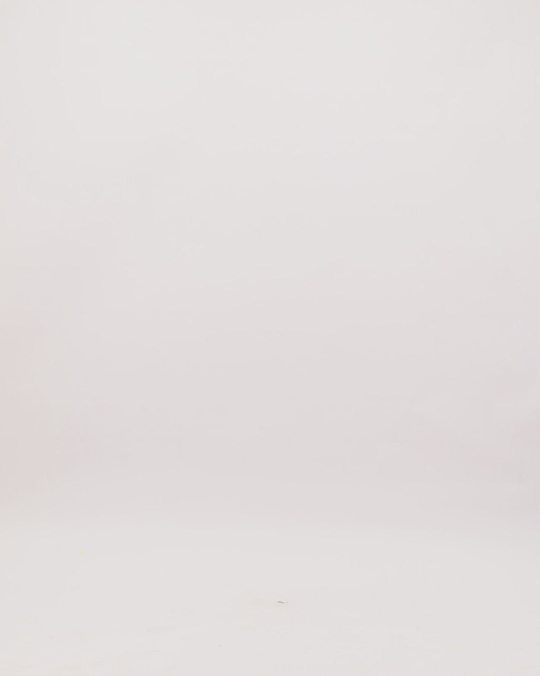 A V-neckline draped evening dress in ice blue satin fabric with cape-like sleeves and a slit on the side.