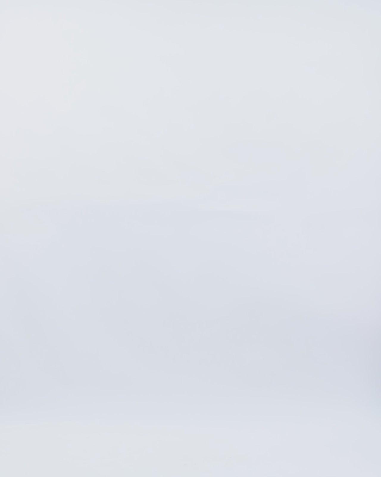 A dark fuchsia strapless evening dress with a plunging neckline and draping on the waistline.